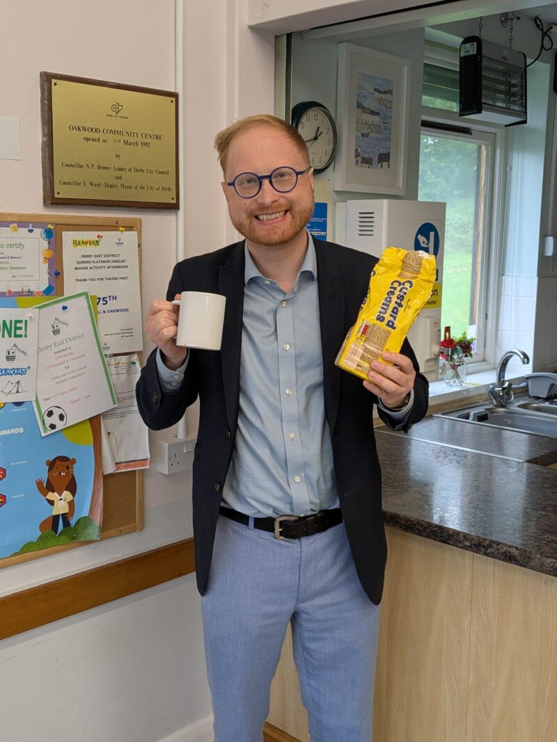 Jonathan Davies MP at a community hall.